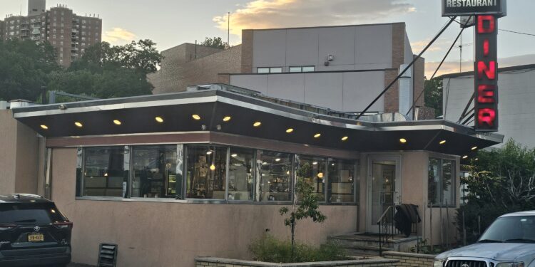 Tibbett Diner exterior at sunset with neon DINER sign, Bronx NYC