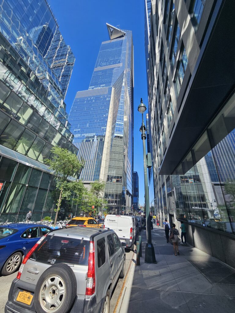 Approaching 30 Hudson Yards from the street with Edge deck visible above