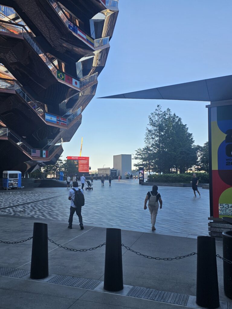 View from inside The Vessel looking toward Hudson Yards public plaza with World Cup 2026 signage