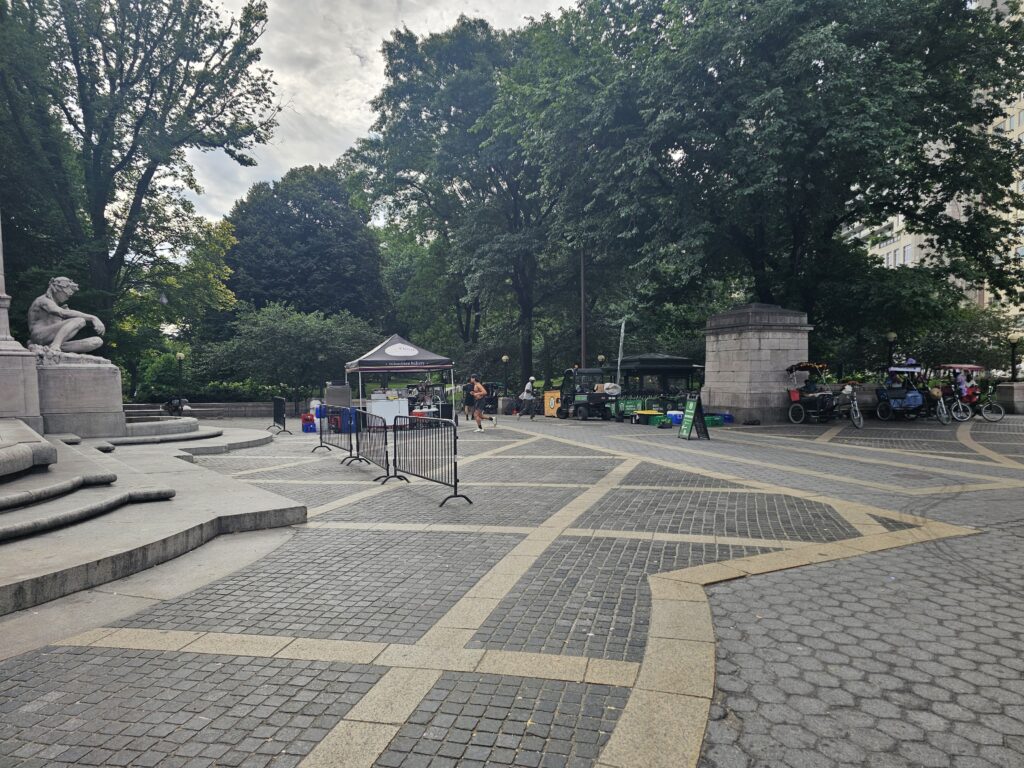 Wide view of the plaza and paved area in front of the USS Maine Monument at Central Park Merchant's Gate