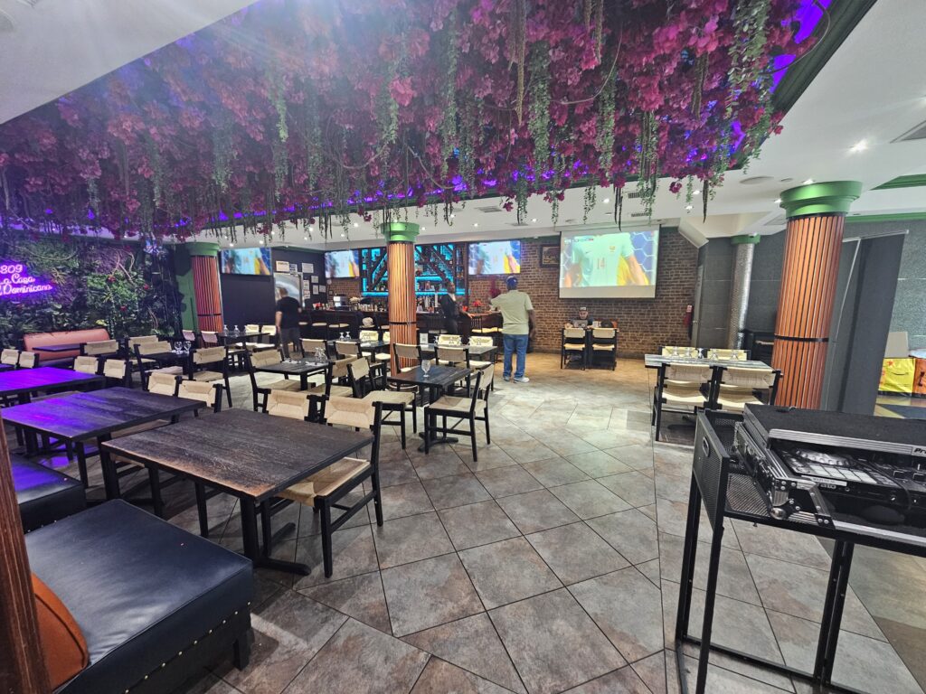 Vibrant interior seating area with colorful lighting at 809 Bar & Grill