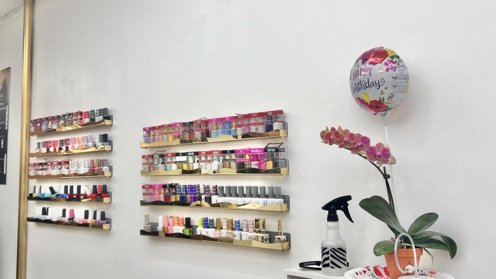 Janails Beauty Salon nail polish display wall Washington Heights NYC
