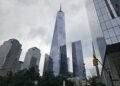 National September 11 Memorial and One World Trade Center skyline view NYC