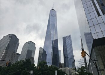National September 11 Memorial and One World Trade Center skyline view NYC