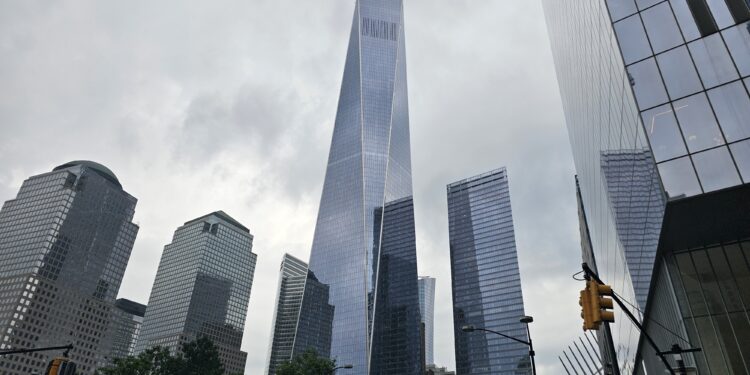 National September 11 Memorial and One World Trade Center skyline view NYC