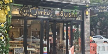 Junko Sushi storefront sign at Broadway and 33rd Street, Astoria