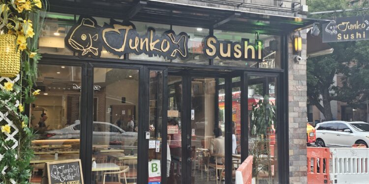 Junko Sushi storefront sign at Broadway and 33rd Street, Astoria