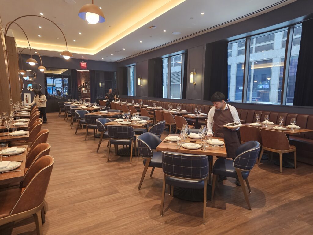 Tallow Steakhouse dining area with natural light along Fifth Avenue windows