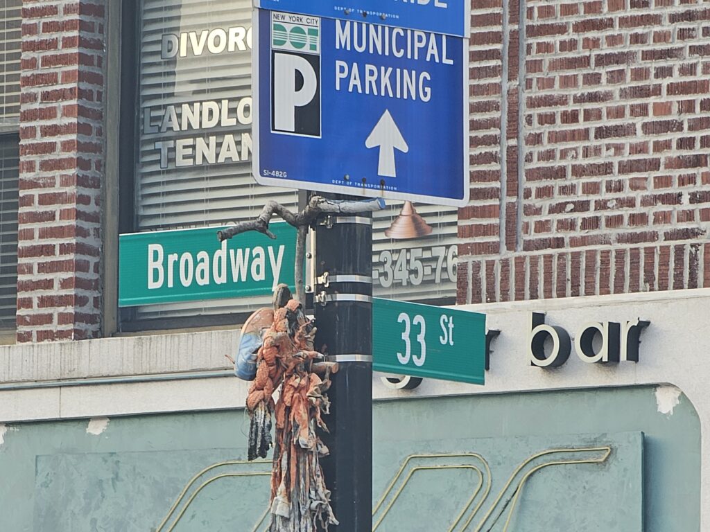 Broadway and 33rd Street sign near Ray's Cheesesteaks Astoria