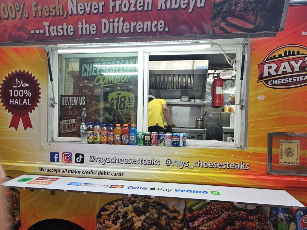 Ray's Cheesesteaks order window with drinks and payment options