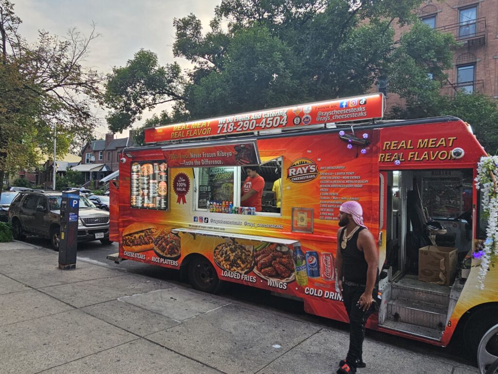 Customers lining up at Ray's Cheesesteaks food truck Astoria