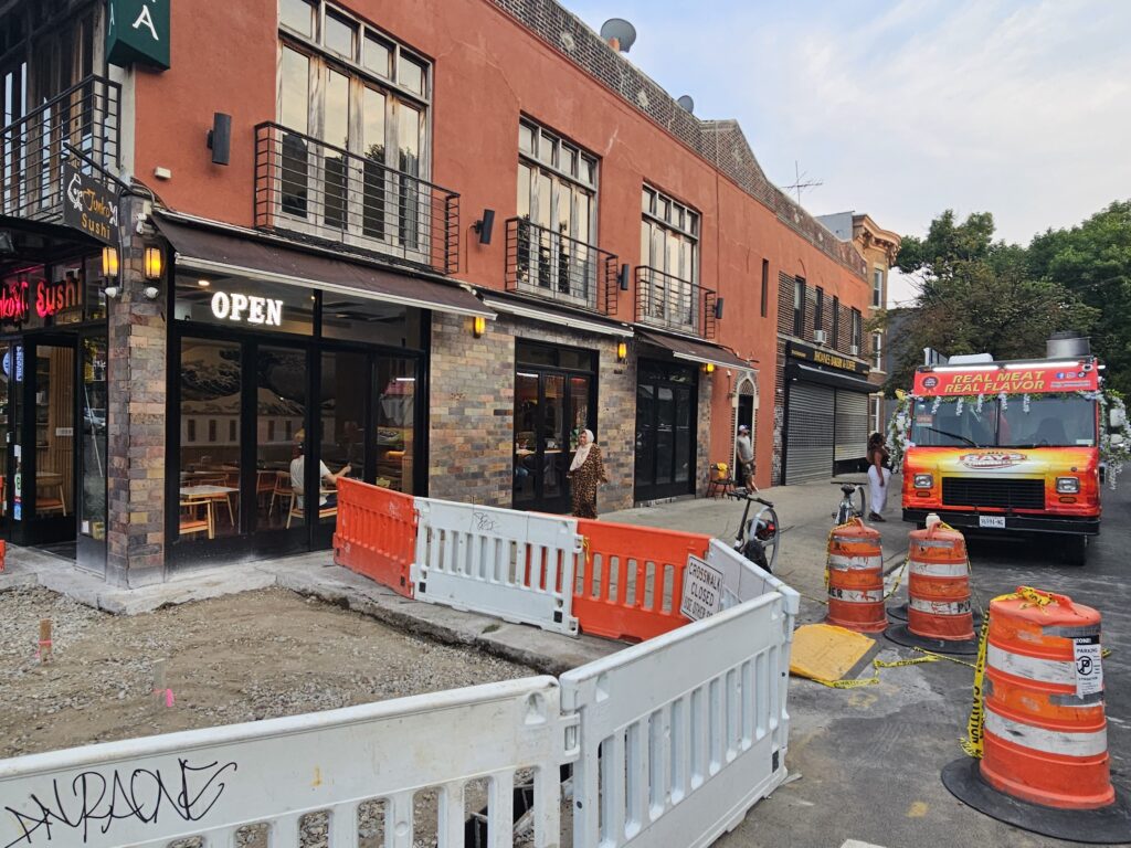 Junko Sushi corner exterior in Astoria Queens in the evening