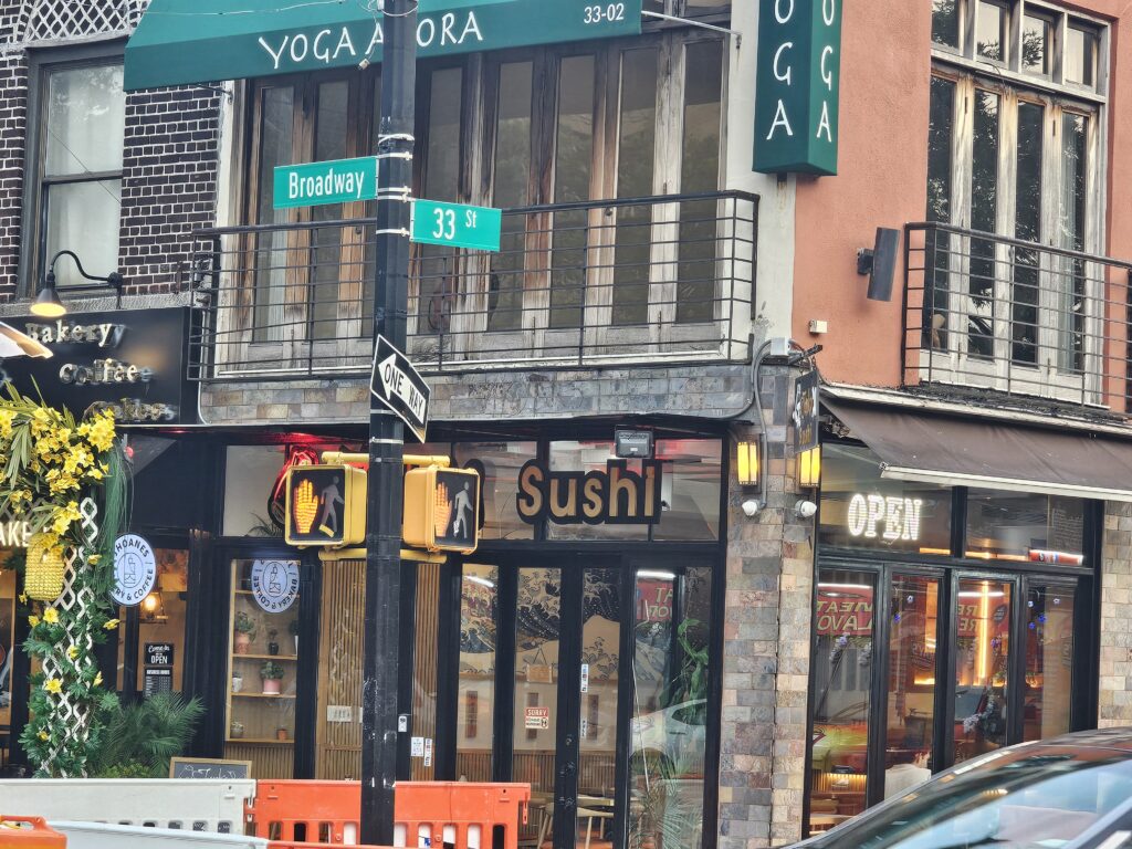 Yoga Agora sign above Junko Sushi at Broadway and 33rd Street