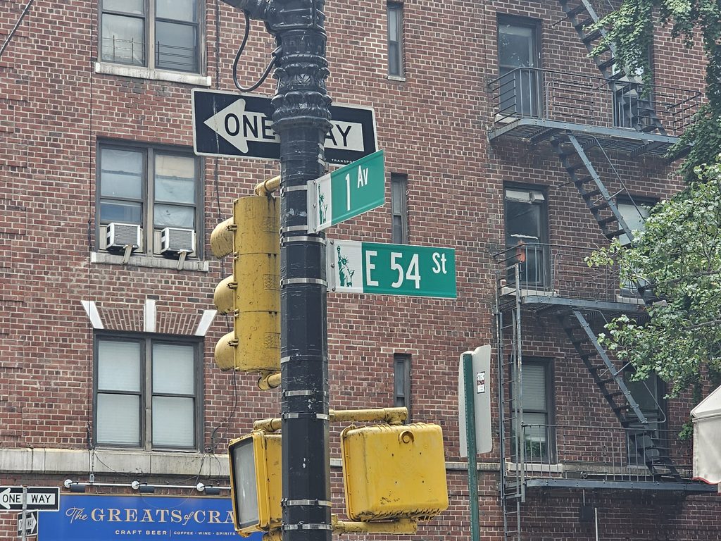 1st Avenue and East 54th Street sign near La Terra Midtown East