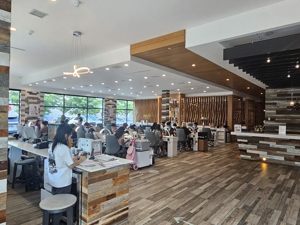 Interior of Victoria's Nails Bronx salon with manicure and pedicure stations