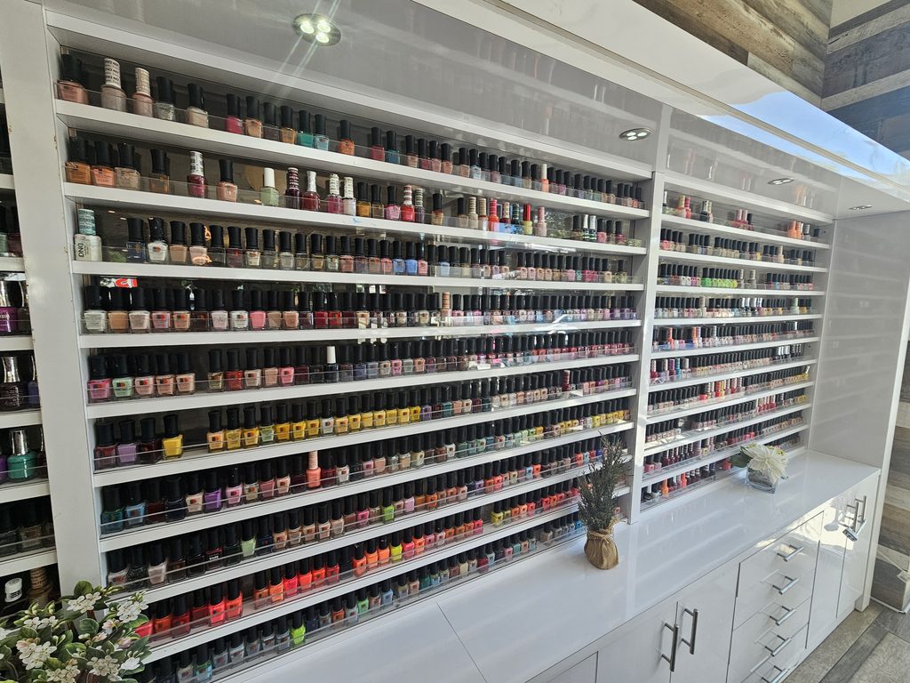 Wall of nail polish colors at Victoria's Nails Bronx
