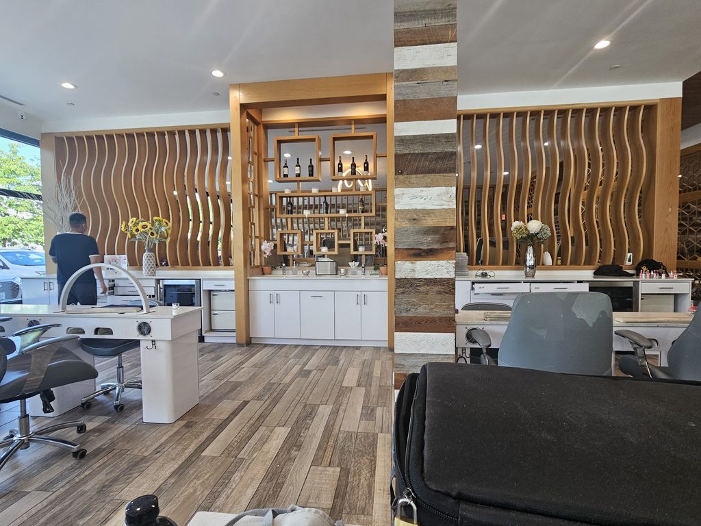 Beverage and spa bar station inside Victoria's Nails Bronx