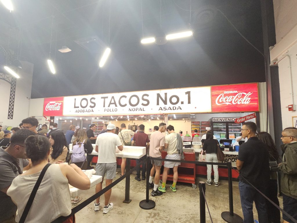 Crowd lined up inside Los Tacos No.1 NYC near Penn Station