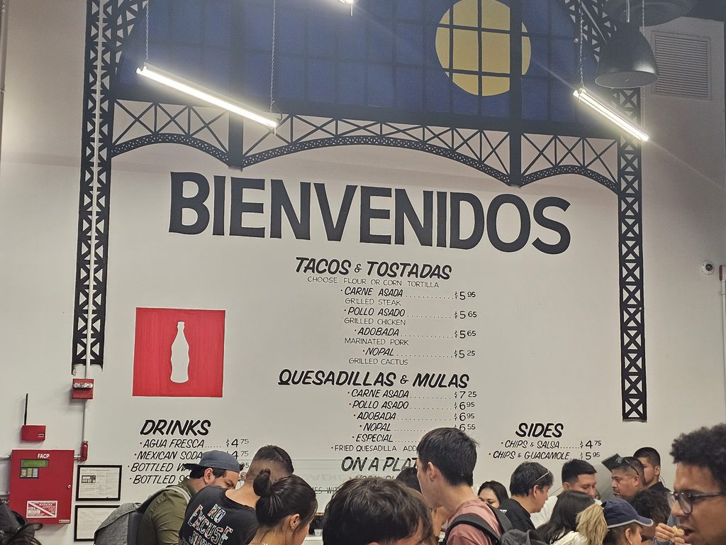 Full tacos and tostadas menu board inside Los Tacos No.1 NYC