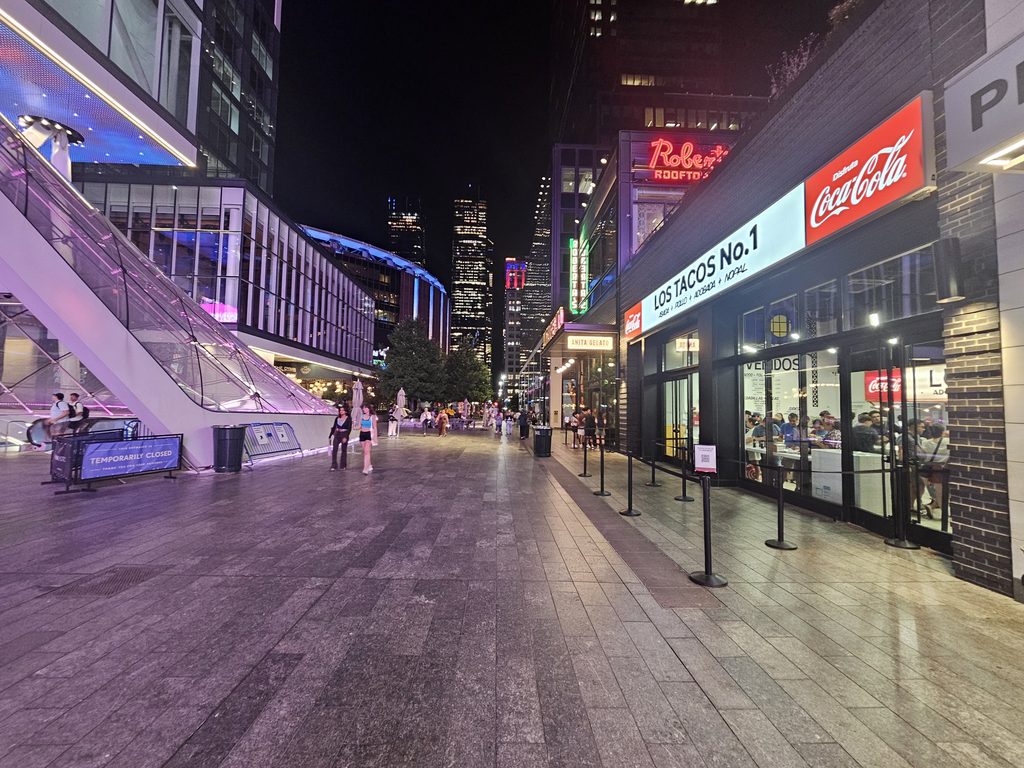 Manhattan West plaza at night steps from Los Tacos No.1 NYC