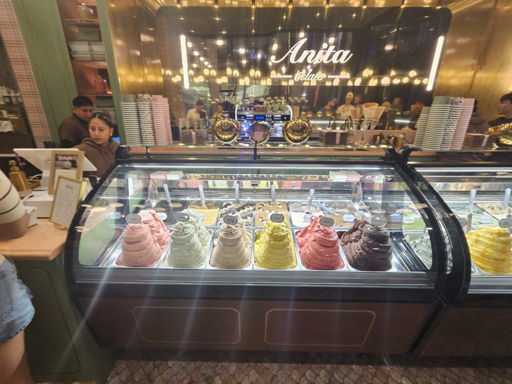 Gelato display case with rotating flavors at Anita Gelato NYC