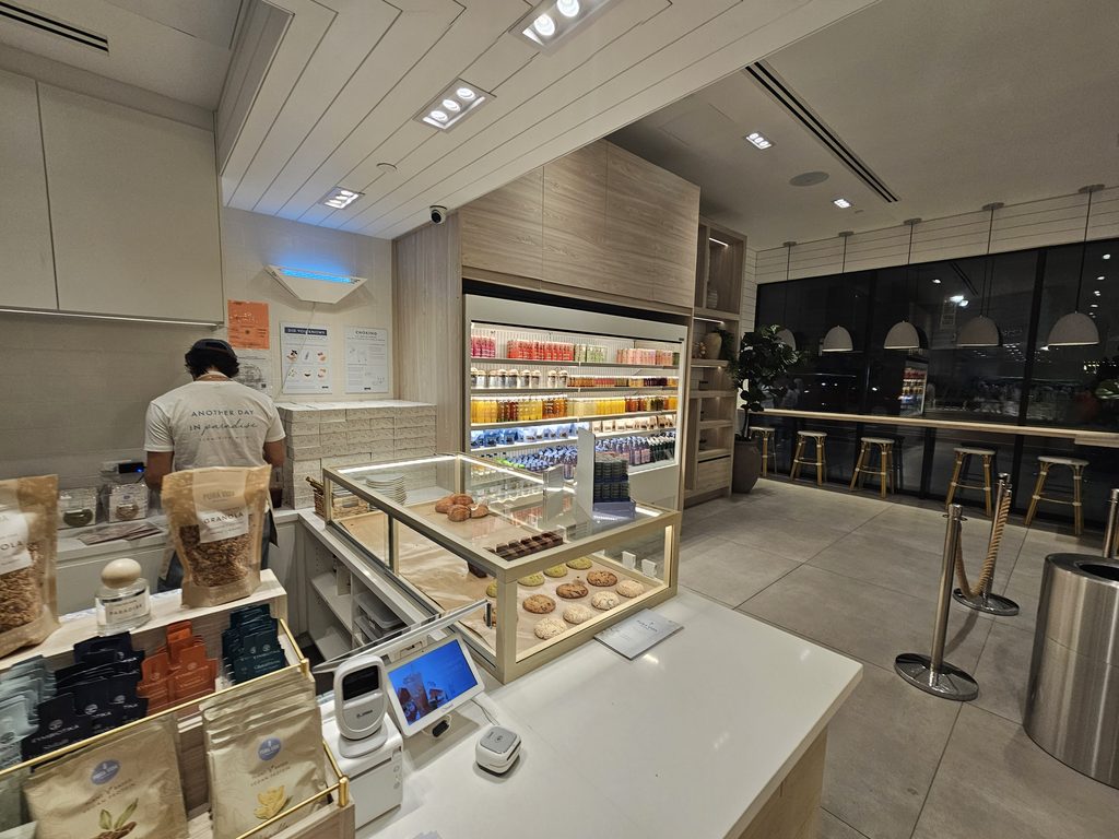 Grab-and-go pastry and snack display case at Pura Vida Miami NYC