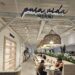 Pura Vida Miami NYC storefront sign glowing above the dining room entrance