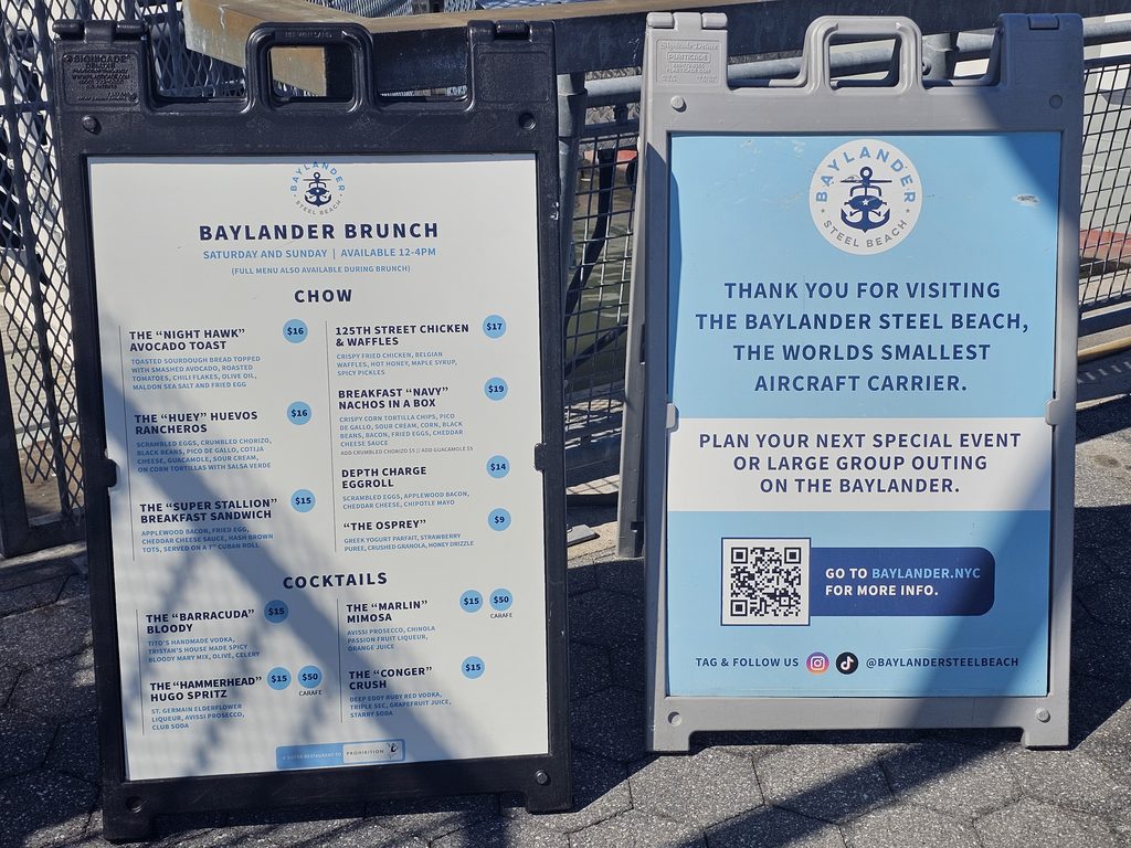 : Gated entrance to West Harlem Piers with Baylander Steel Beach visible