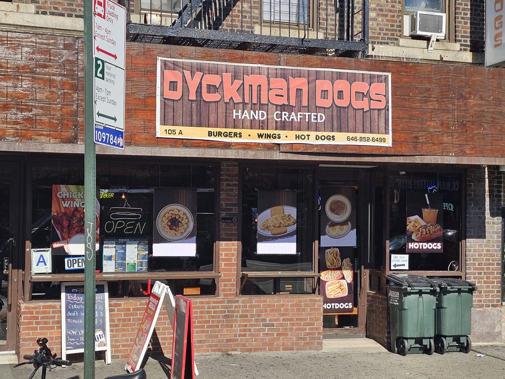 Dyckman Dogs NYC storefront sign on Dyckman Street in Inwood