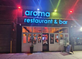 Aroma Restaurant Bar neon storefront sign on Broadway in the Bronx