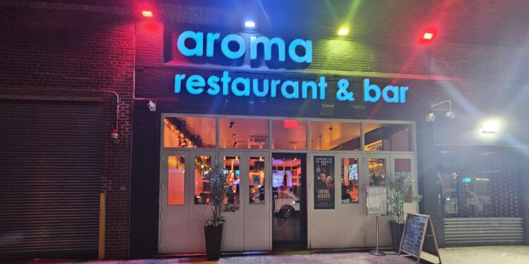Aroma Restaurant Bar neon storefront sign on Broadway in the Bronx