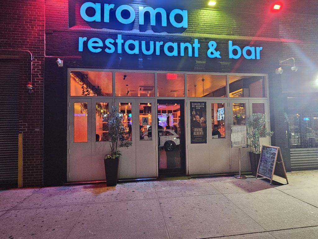 Aroma Restaurant Bar neon storefront sign on Broadway in the Bronx
