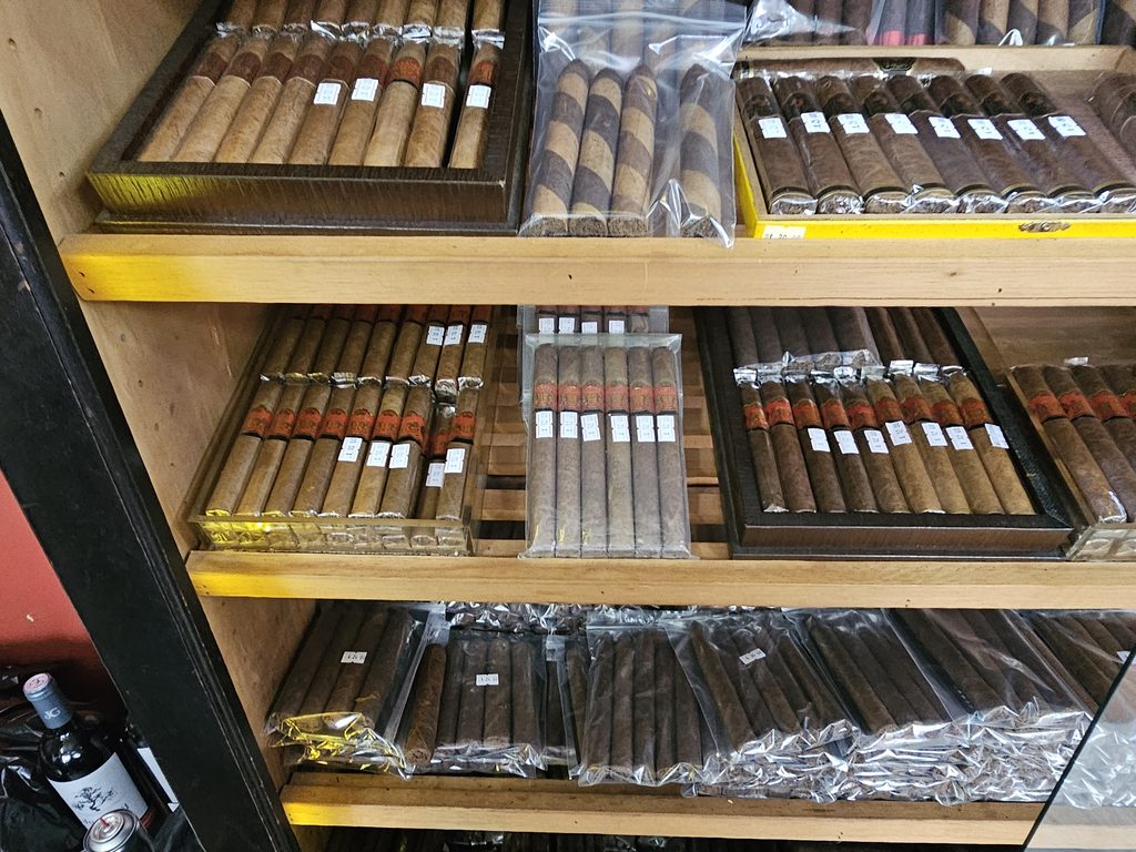 Shelves of handmade premium cigars on display at Portes Cigars in Inwood