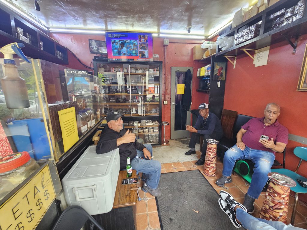 Locals relaxing and watching a game inside the Portes Cigars lounge in Inwood