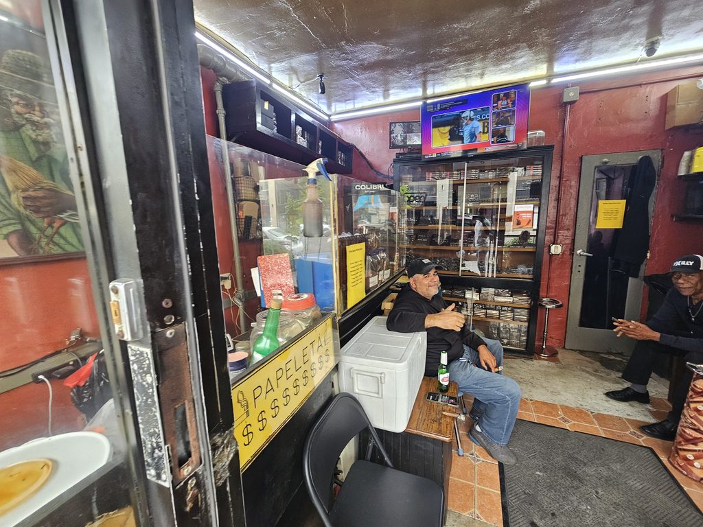 Interior view of the Portes Cigars shop and lounge seating area in Inwood