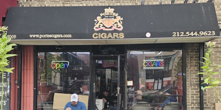 Portes Cigars NYC storefront with black awning on Broadway in Inwood, Manhattan