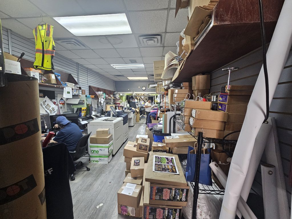 Interior production floor at Lino Press NY with staff working at digital printing stations