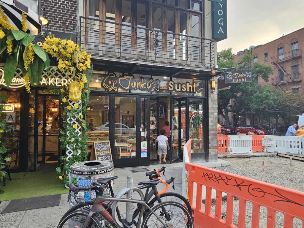Junko Sushi and Yoga Agora storefront corner in Astoria Queens