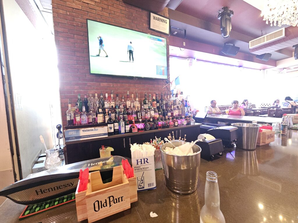 La Casa del Mofongo bar with liquor display and bottle service setup