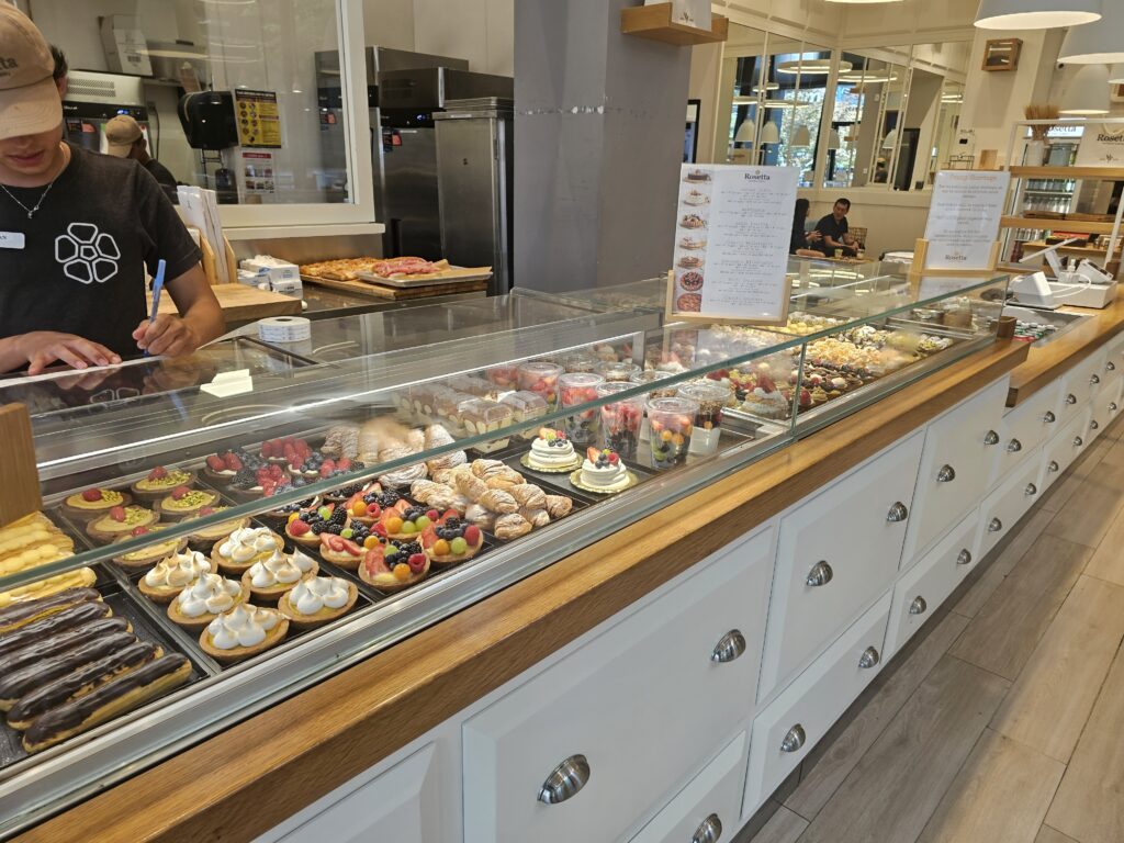 Rosetta Bakery pastry case with tarts, éclairs, and Italian sweets