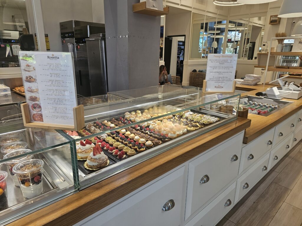 Rosetta Bakery custom cake menu board with Sacher Torte and Millefoglie pricing