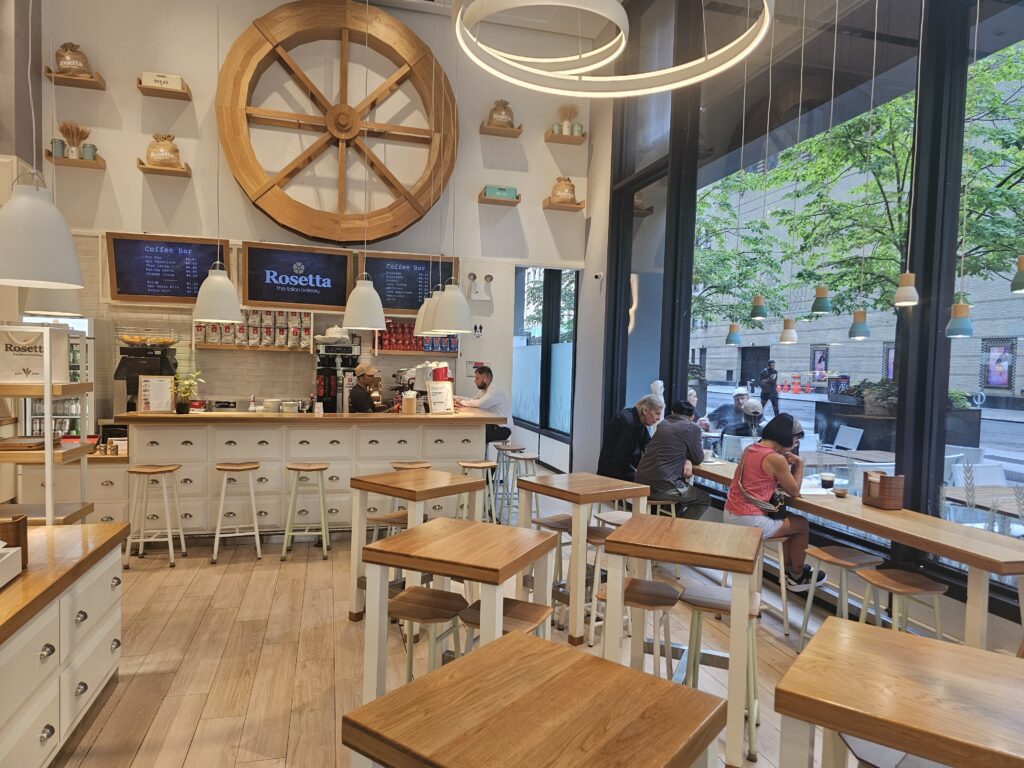 Rosetta Bakery seating area with wagon wheel decor and street-facing windows