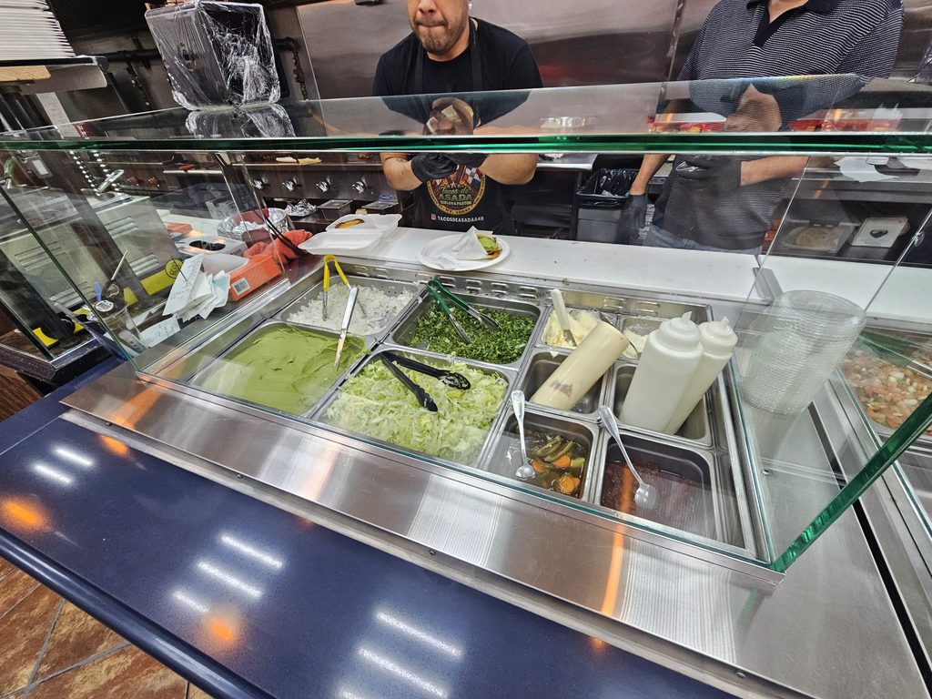 Fresh toppings and salsa counter.