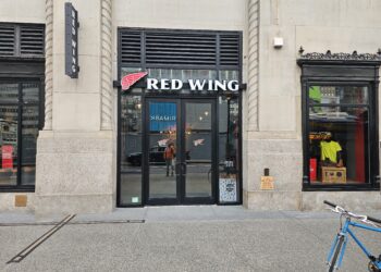 Red Wing Shoes NYC flagship storefront entrance with red wing logo at 11 Penn Plaza in Midtown Manhattan