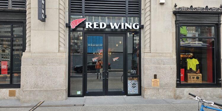 Red Wing Shoes NYC flagship storefront entrance with red wing logo at 11 Penn Plaza in Midtown Manhattan