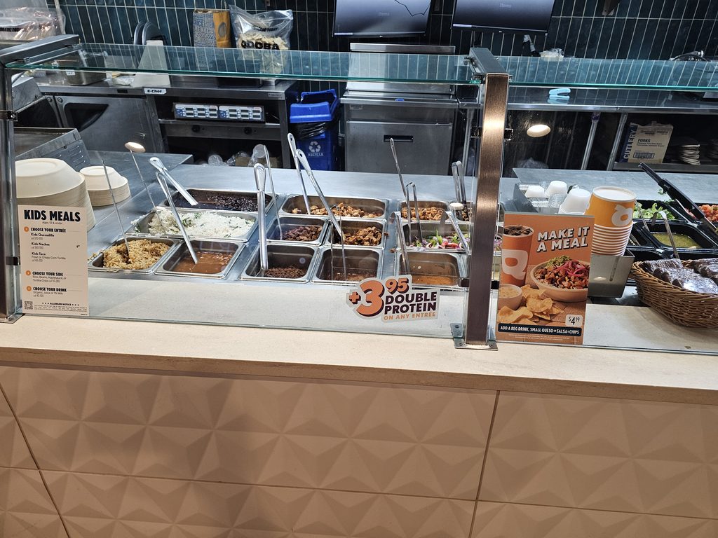 Build-your-own protein line and hot bar at QDOBA Fordham Road in the Bronx