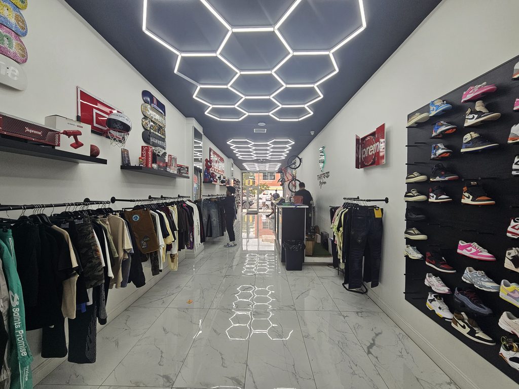 The store's signature geometric LED ceiling