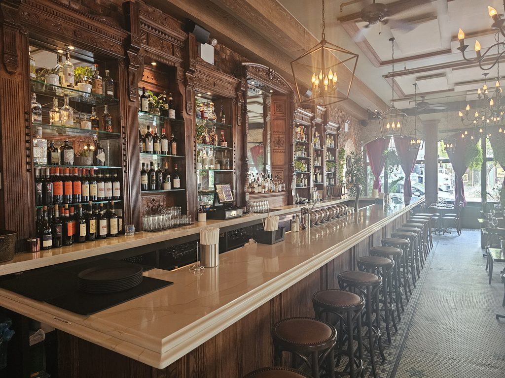 A wide look at the dining room and table setting.