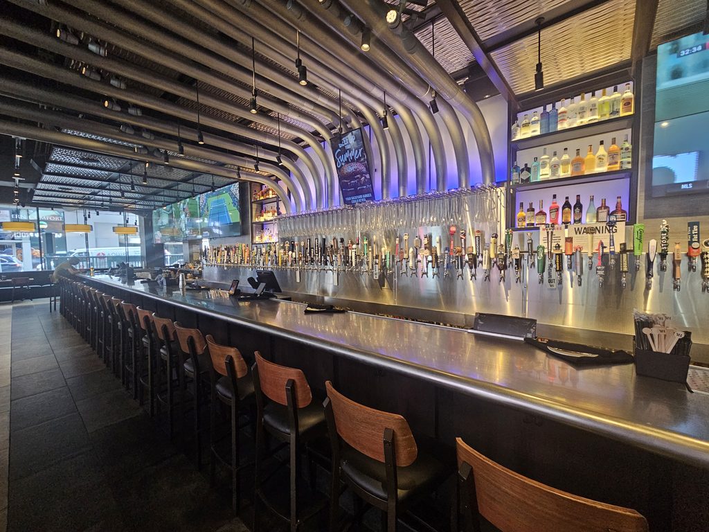 Yard House NYC bar counter and illuminated interior