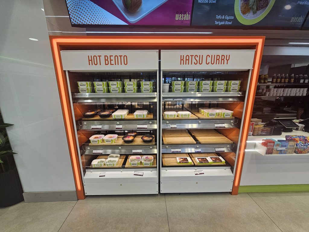 Hot bento and prepared Japanese meals on display at Wasabi Sushi & Bento Times Square